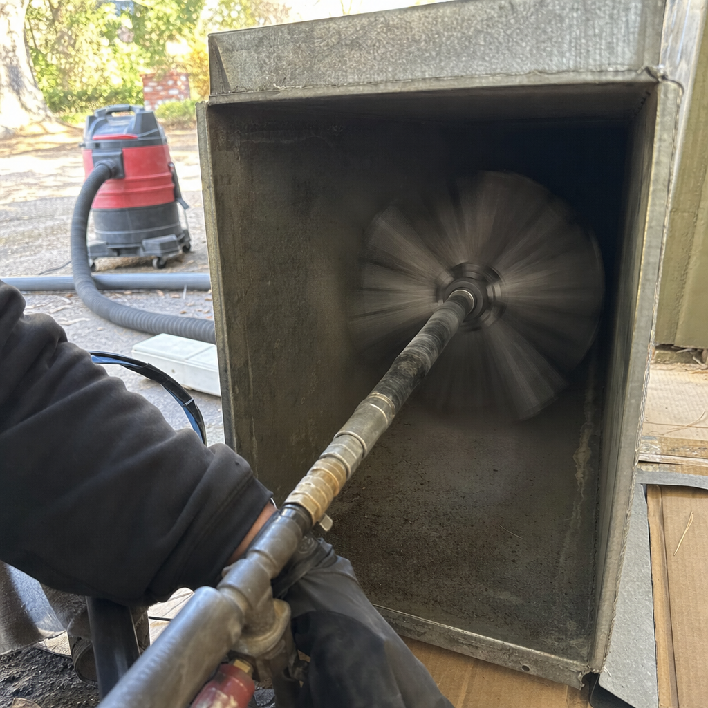 Professional air duct cleaning service with rotating brush